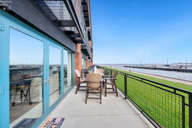 balcony featuring a water view