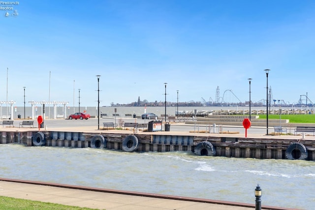surrounding community featuring a water view