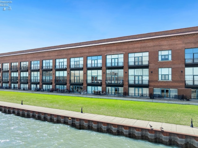 view of building exterior with a water view