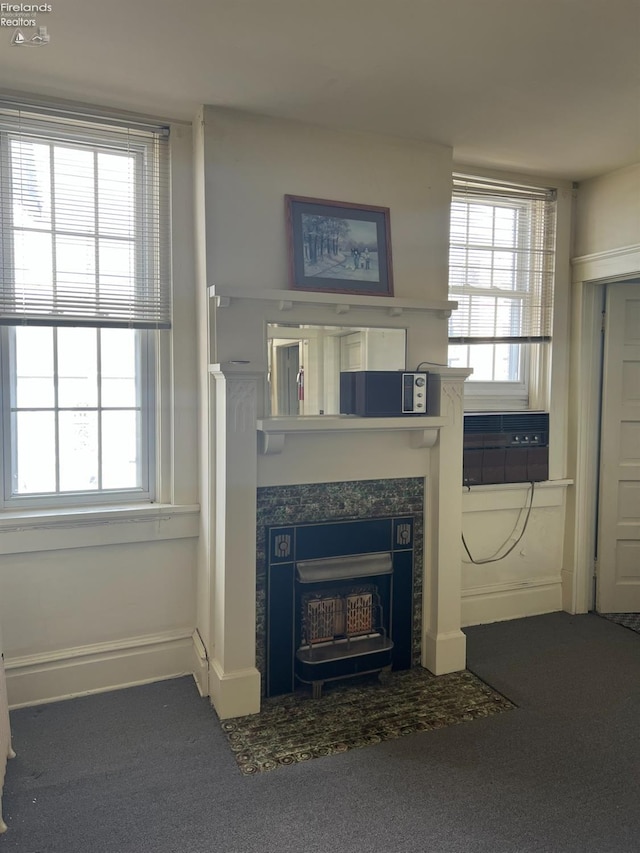 unfurnished living room featuring a fireplace and carpet floors