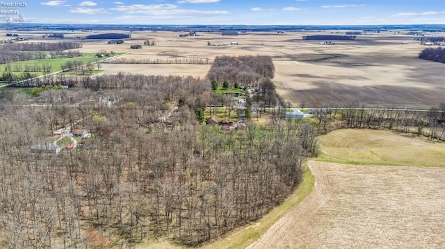 birds eye view of property featuring a rural view