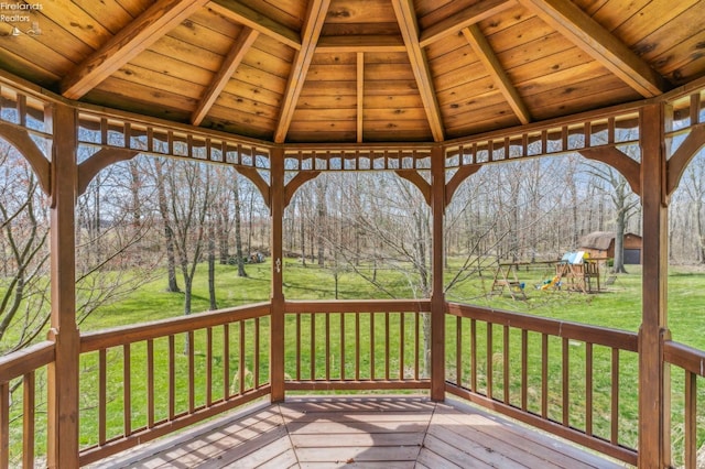 wooden terrace with a gazebo, a yard, and a playground