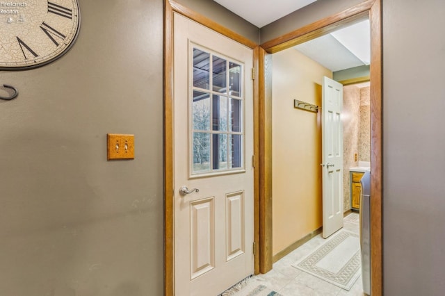 hallway with light tile patterned floors