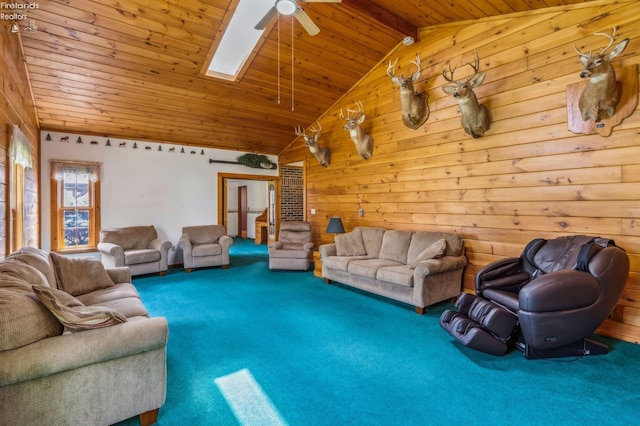 carpeted living room with wooden ceiling, wood walls, ceiling fan, and vaulted ceiling with skylight