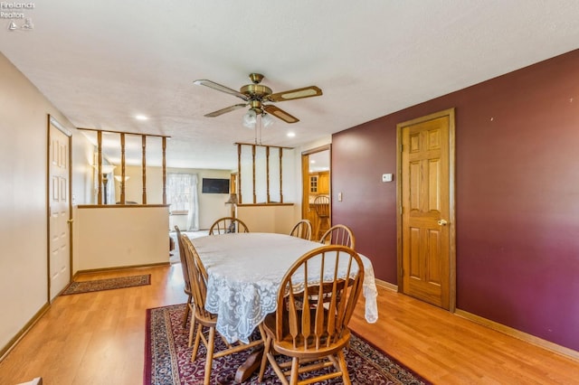 dining area featuring baseboards, a ceiling fan, light wood finished floors, and recessed lighting