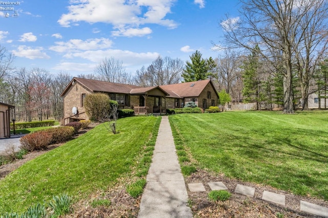 ranch-style house with fence and a front yard