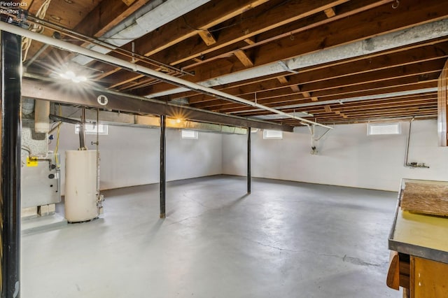basement featuring gas water heater