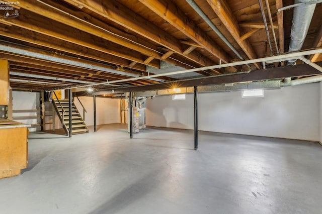 basement featuring stairs