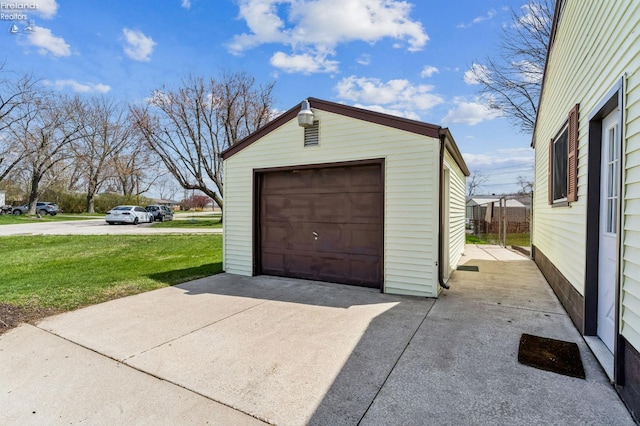 detached garage featuring driveway