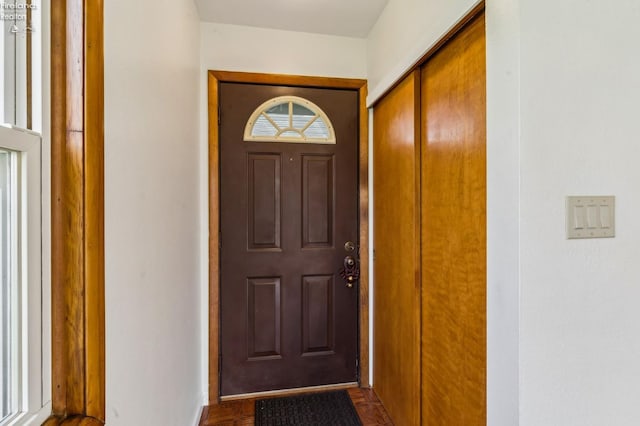 entryway featuring baseboards