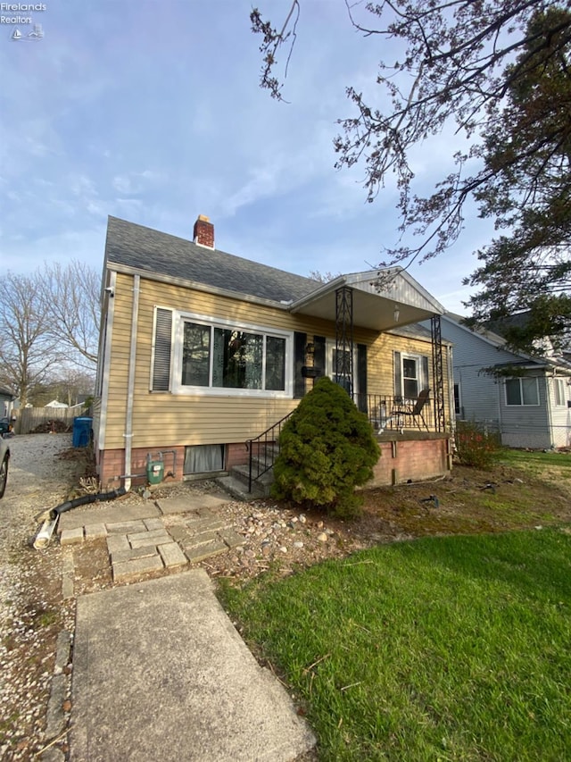 457 Morrison St, Fremont, OH 43420 - view of front facade with a chimney and covered porch