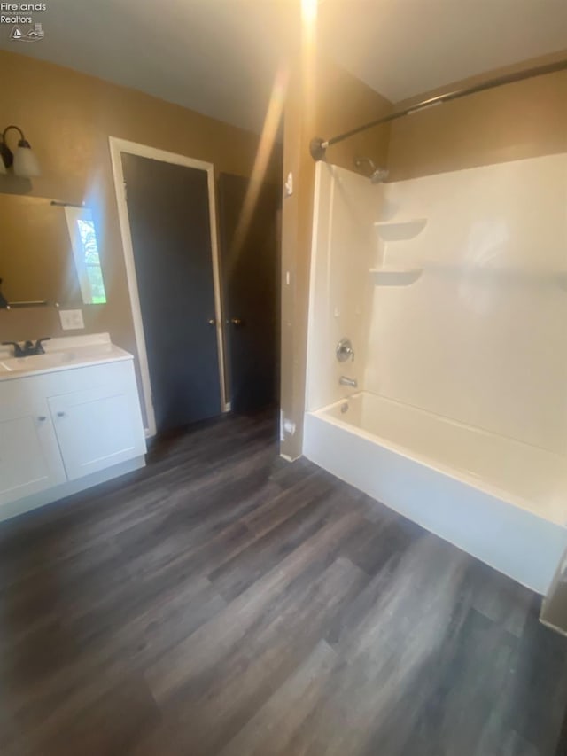 457 Morrison St, Fremont, OH 43420 - full bathroom with wood finished floors, vanity, and bathtub / shower combination
