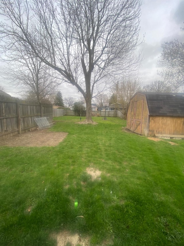 457 Morrison St, Fremont, OH 43420 - view of yard with an outdoor structure, a fenced backyard, and a storage shed
