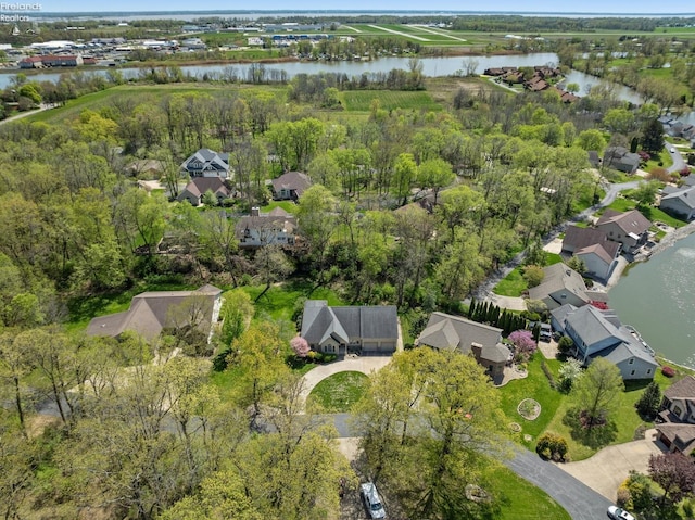 bird's eye view featuring a water view and a residential view