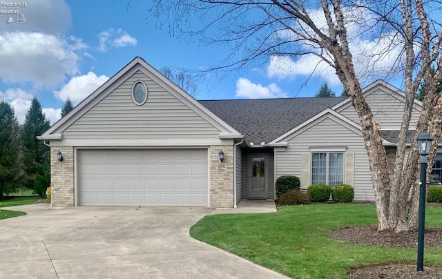 single story home with concrete driveway, a front lawn, a shingled roof, a garage, and brick siding