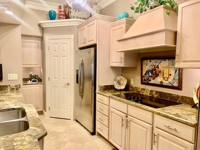 kitchen with light stone counters, stainless steel fridge with ice dispenser, crown molding, black electric stovetop, and custom range hood