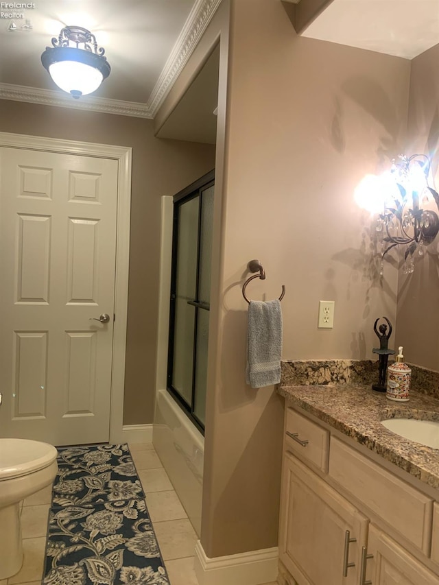 full bathroom featuring tile patterned floors, combined bath / shower with glass door, vanity, toilet, and ornamental molding