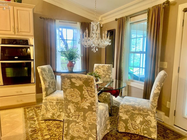 living area featuring plenty of natural light, baseboards, an inviting chandelier, and crown molding