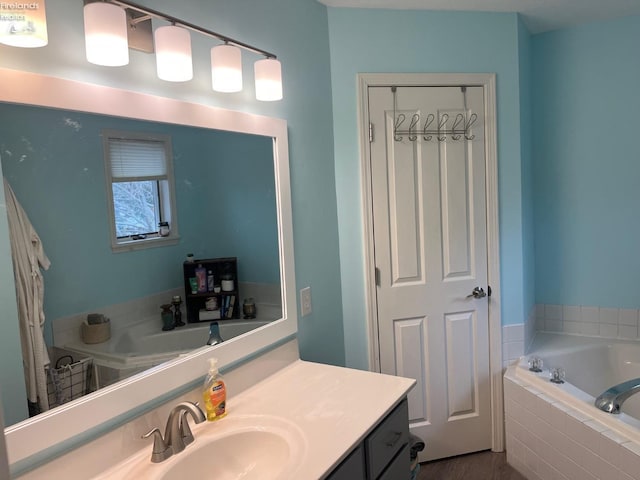 full bath with a bath and vanity