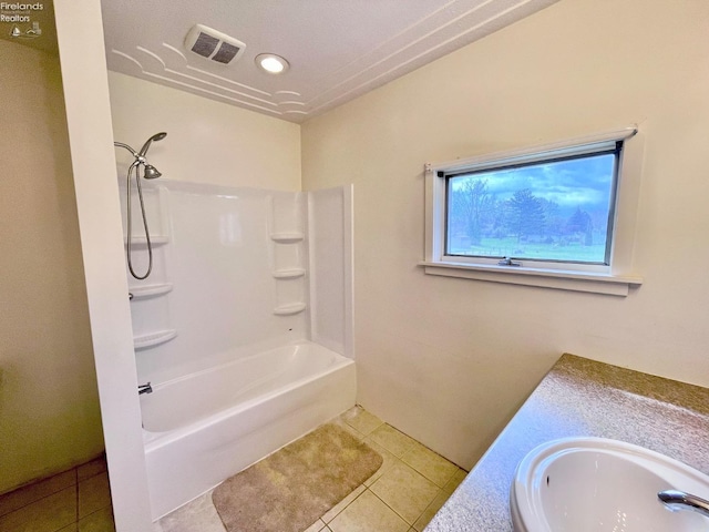 bathroom with vanity, tile patterned flooring, visible vents, and tub / shower combination