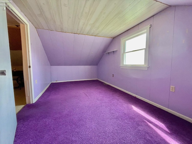additional living space featuring wood ceiling, lofted ceiling, carpet floors, and baseboards
