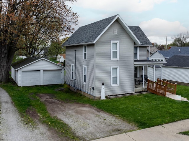 113 W Grant St, Clyde, OH 43410 - exterior space with a garage, a porch, an outdoor structure, and roof with shingles