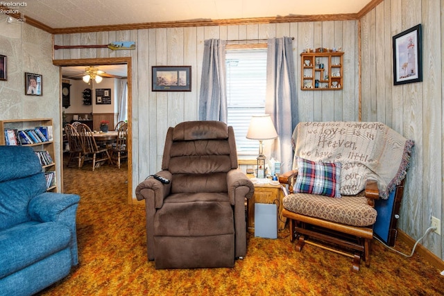 113 W Grant St, Clyde, OH 43410 - interior space with ornamental molding, a ceiling fan, wooden walls, and carpet floors