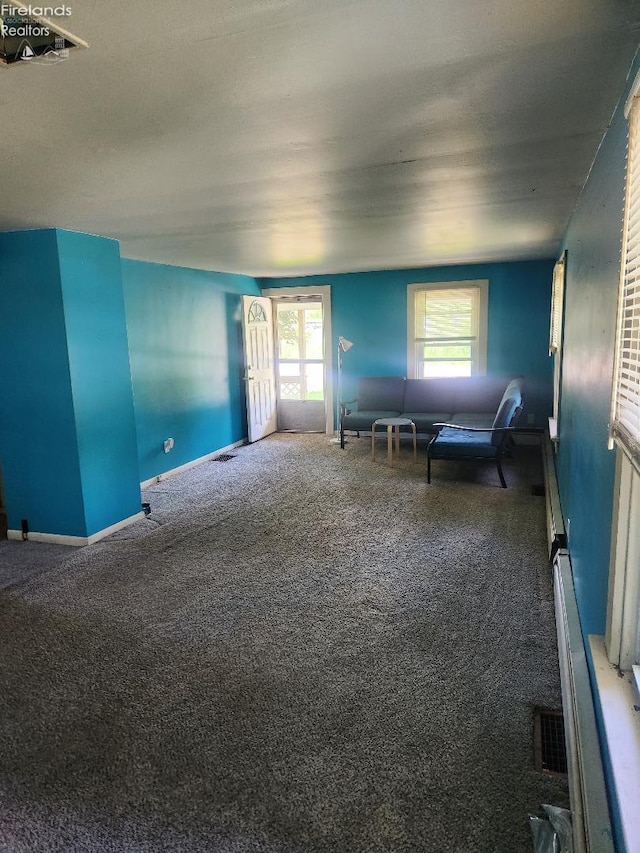 1501 E State St, Port Clinton, OH 43452 - living area with carpet and plenty of natural light