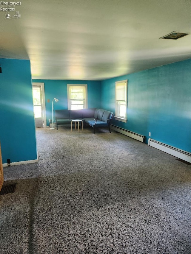 1501 E State St, Port Clinton, OH 43452 - carpeted living area featuring a baseboard radiator and baseboards
