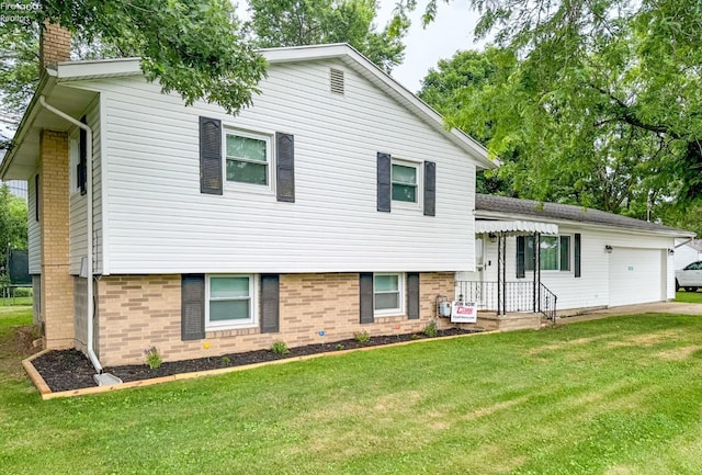 tri-level home featuring an attached garage, a chimney, a front yard, and concrete driveway