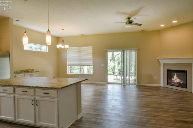 4340 E Mckenna Ln, Port Clinton, OH 43452 - kitchen featuring open floor plan, dark wood-style floors, white cabinets, ceiling fan, and a chandelier