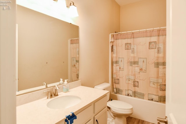 4340 E Mckenna Ln, Port Clinton, OH 43452 - full bath with toilet, vanity, shower / bath combo with shower curtain, and wood finished floors