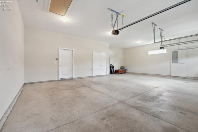 4340 E Mckenna Ln, Port Clinton, OH 43452 - garage featuring electric panel and a garage door opener