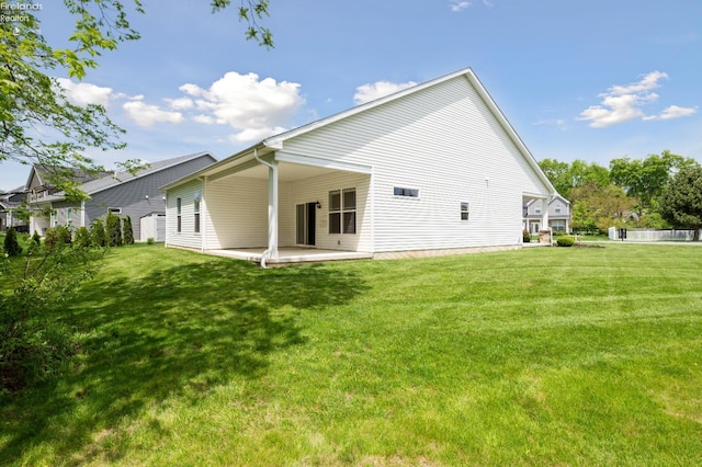 4340 E Mckenna Ln, Port Clinton, OH 43452 - rear view of property featuring a patio and a yard