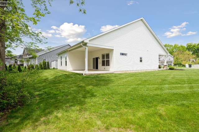 4340 E Mckenna Ln, Port Clinton, OH 43452 - rear view of property with a patio area and a yard