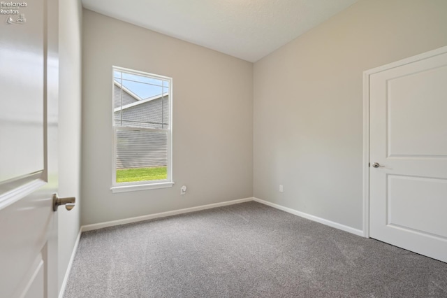 4340 E Mckenna Ln, Port Clinton, OH 43452 - carpeted empty room featuring healthy amount of natural light and baseboards