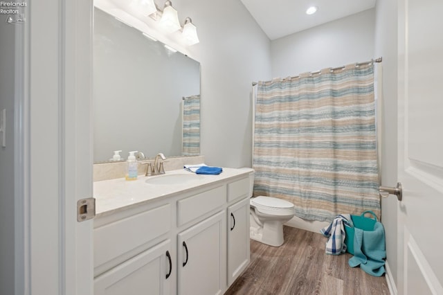 4340 E Mckenna Ln, Port Clinton, OH 43452 - full bath featuring wood finished floors, toilet, vanity, and curtained shower