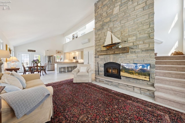 2951 N Chickadee Prt, Clinton, OH 43452 - living area featuring high vaulted ceiling, plenty of natural light, an AC wall unit, and a stone fireplace