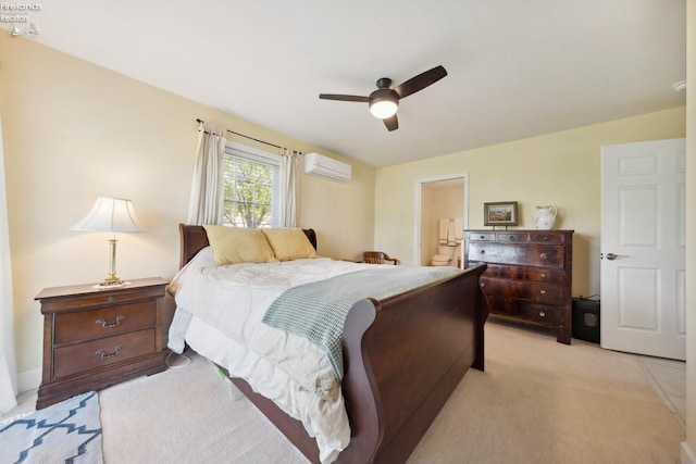 2951 N Chickadee Prt, Clinton, OH 43452 - bedroom featuring ceiling fan, a wall mounted AC, light carpet, and ensuite bath