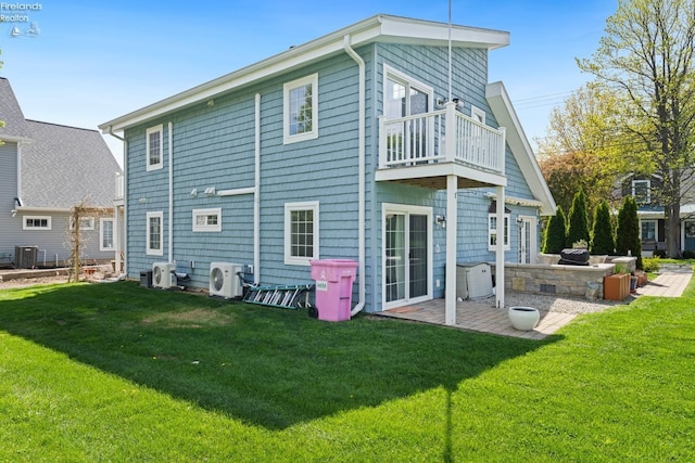 2951 N Chickadee Prt, Clinton, OH 43452 - back of house with a yard, an outdoor kitchen, ac unit, and a balcony