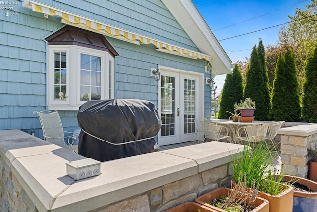 2951 N Chickadee Prt, Clinton, OH 43452 - view of patio / terrace featuring french doors and area for grilling