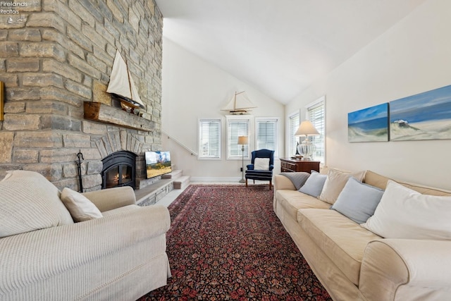 2951 N Chickadee Prt, Clinton, OH 43452 - living area with baseboards, high vaulted ceiling, and a stone fireplace