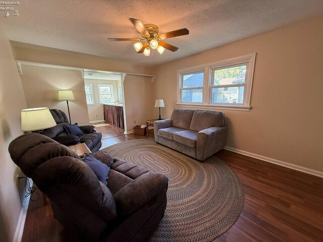 120 Schiller Ave, Sandusky, OH 44870 - living area with ceiling fan, baseboards, wood finished floors, and a textured ceiling
