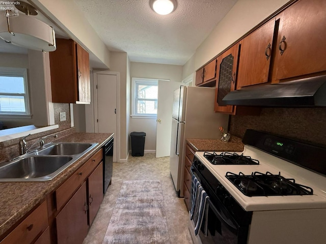 120 Schiller Ave, Sandusky, OH 44870 - kitchen featuring a sink, a textured ceiling, gas range oven, under cabinet range hood, and black dishwasher