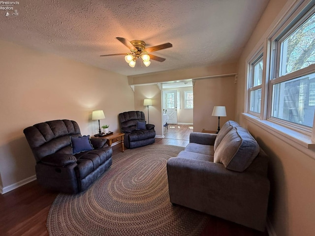 120 Schiller Ave, Sandusky, OH 44870 - living area featuring wood finished floors, a textured ceiling, baseboards, and ceiling fan