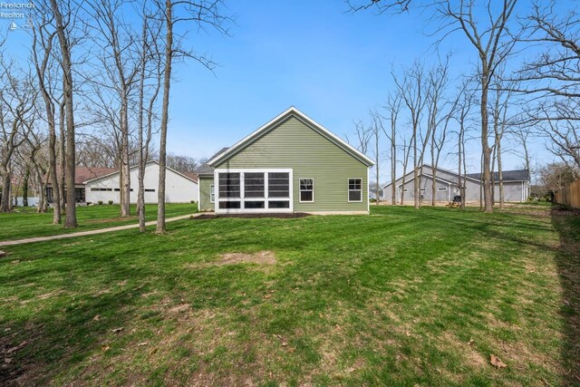 4220 Mckenna Ln, Port Clinton, OH 43452 - back of house featuring a yard