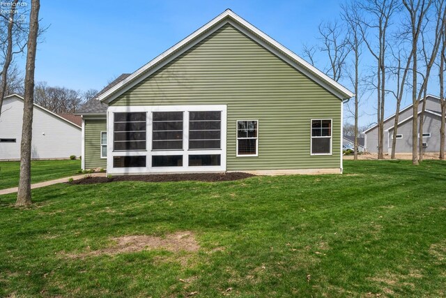 4220 Mckenna Ln, Port Clinton, OH 43452 - back of house with a yard