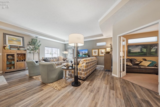 4220 Mckenna Ln, Port Clinton, OH 43452 - living area featuring a raised ceiling, wood finished floors, and baseboards