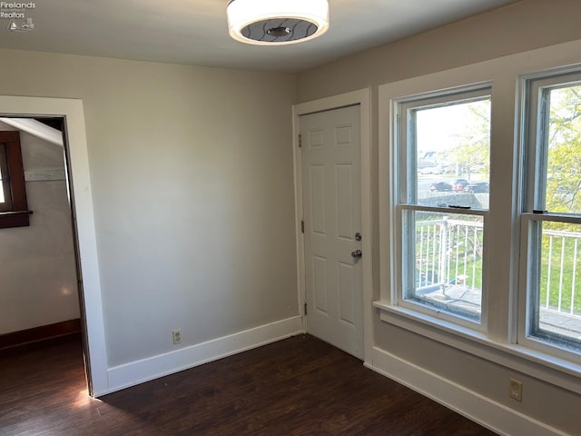 701 Polk St, Sandusky, OH 44870 - interior space with dark wood-type flooring and baseboards