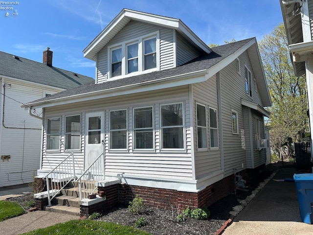 701 Polk St, Sandusky, OH 44870 - bungalow with crawl space, a shingled roof, and entry steps